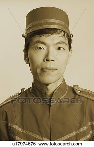 Portrait of a bellhop thinking View Large Photo Image Stock Photograph - Portrait of a bellhop thinking. Fotosearch