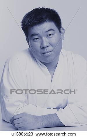 Portrait of a mid adult man wearing a karate uniform View Large Photo Image Stock Image - Portrait of a mid adult man wearing a karate uniform. Fotosearch