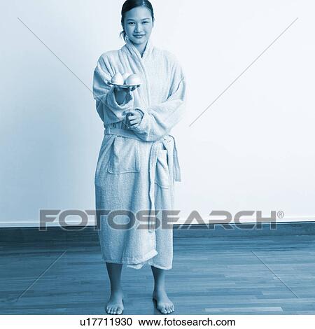 Portrait of a young woman holding soap bars in a plate View Large Photo Image Stock Image - Portrait of a young woman holding soap bars in a plate. Fotosearch