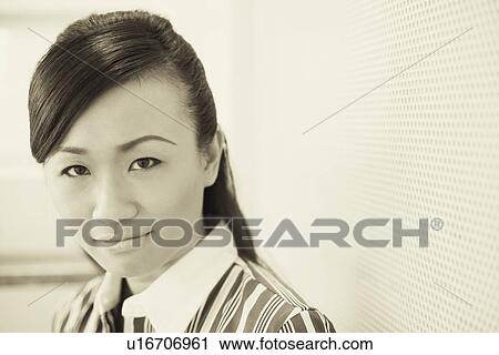 Portrait of a young woman smiling View Large Photo Image Stock Image - Portrait of a young woman smiling. Fotosearch