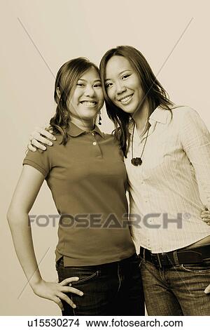 Picture - Portrait of two young women smiling. Fotosearch