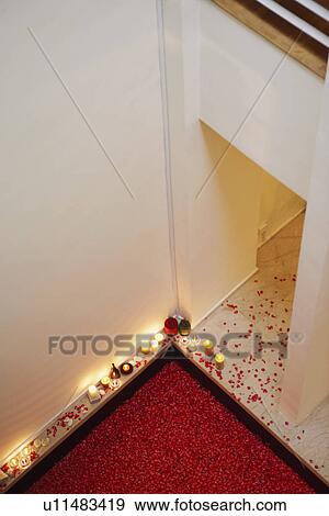 Stock Photo - High angle view of a hot tub covered with rose petals. Fotosearch