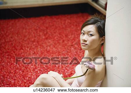 Portrait of a young woman sitting near a hot tub and thinking View Large Photo Image Stock Photo - Portrait of a young woman sitting near a hot tub and thinking. Fotosearch
