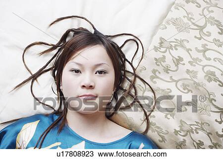 Portrait of a young woman thinking View Large Photo Image Stock Image - Portrait of a young woman thinking. Fotosearch