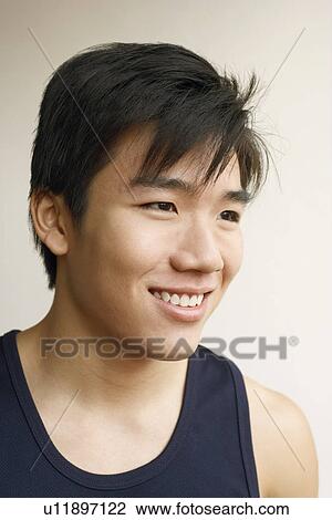 Stock Image - Close-up of a young man smiling. Fotosearch