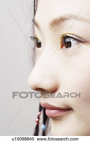 Close-up of a young woman View Large Photo Image Stock Photography - Close-up of a young woman. Fotosearch