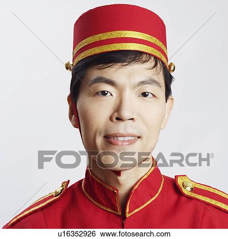 Portrait of a bellhop smiling View Large Photo Image Stock Photograph - Portrait of a bellhop smiling. Fotosearch