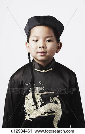 Portrait of a boy looking serious View Large Photo Image Stock Image - Portrait of a boy looking serious. Fotosearch