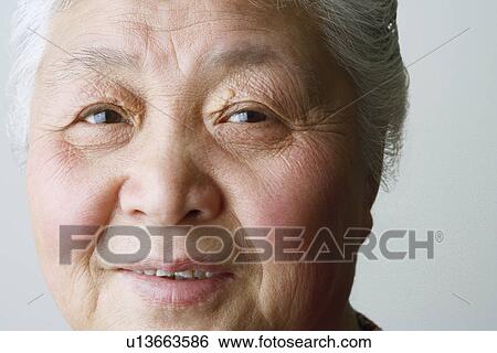Stock Photograph - Portrait of a senior woman smiling. Fotosearch