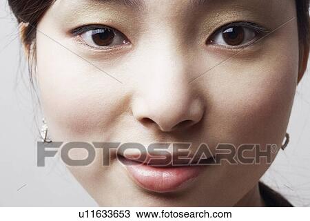 Stock Image - Portrait of a young Asian woman. Fotosearch