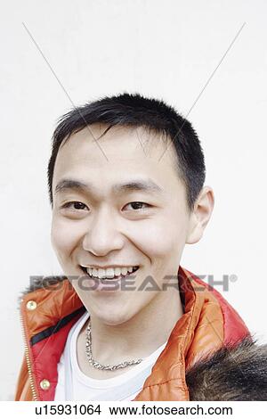 Portrait of a young man smiling View Large Photo Image Picture - Portrait of a young man smiling. Fotosearch
