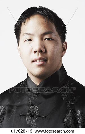 Stock Image - Portrait of a young man smiling. Fotosearch