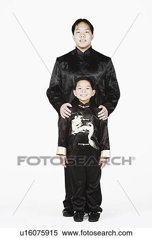 Stock Photography - Portrait of a father and his son smiling together. Fotosearch