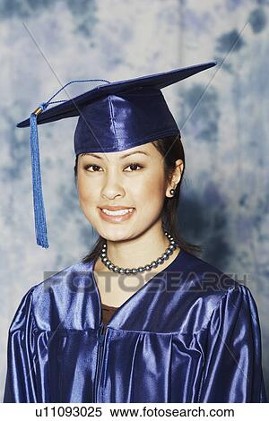 Portrait of a female graduate smiling View Large Photo Image Stock Photography - Portrait of a female graduate smiling. Fotosearch
