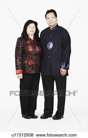 Stock Photo - Portrait of a mature couple standing together smiling. Fotosearch