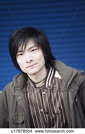 Portrait of a young man smiling View Large Photo Image Picture - Portrait of a young man smiling. Fotosearch