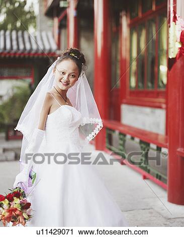 Portrait of a young woman in the wedding dress View Large Photo Image Stock Image - Portrait of a young woman in the wedding dress. Fotosearch