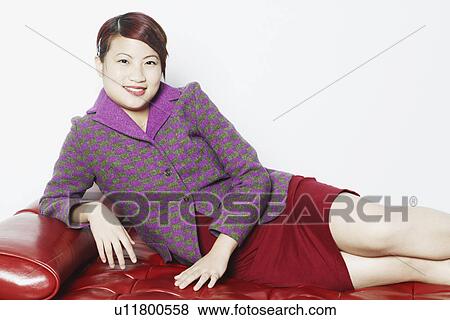 Stock Photo - Portrait of a young woman smiling. Fotosearch