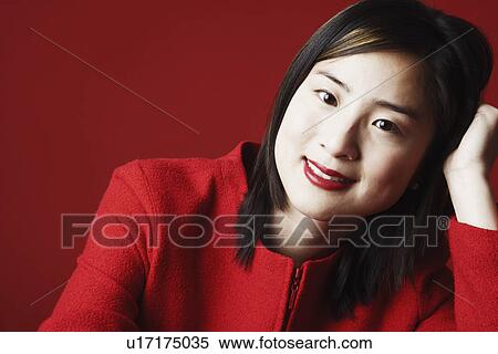 Stock Photography - Portrait of a young woman smiling. Fotosearch