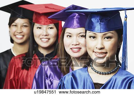 Portrait of four female graduates standing in a row View Large Photo Image Stock Image - Portrait of four female graduates standing in a row. Fotosearch