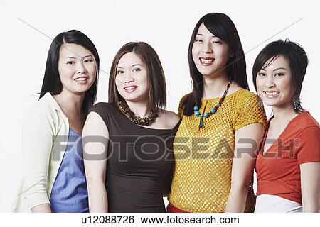 Portrait of four young women smiling View Large Photo Image Stock Photograph - Portrait of four young women smiling. Fotosearch