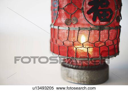 Candle lit in a lantern View Large Photo Image Stock Photography - Candle lit in a lantern. Fotosearch