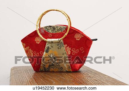 Stock Image - Close-up of a hand bag. Fotosearch