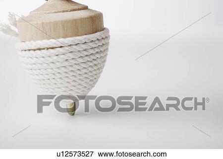 Stock Photo - Close-up of a top wrapped in string. Fotosearch
