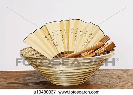Close-up of folding fans in a basket View Large Photo Image Stock Photo - Close-up of folding fans in a basket. Fotosearch