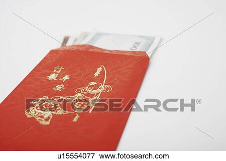Stock Photo - Close-up of paper currency in an envelope. Fotosearch