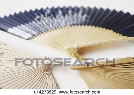 Stock Photo - Close-up of three folding fans. Fotosearch