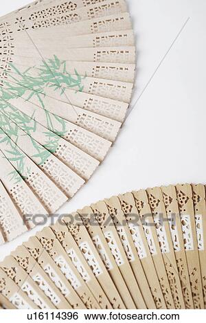 Close-up of two folding fans View Large Photo Image Stock Photograph - Close-up of two folding fans. Fotosearch