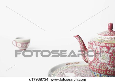 Picture - Close-up of a teapot on a tray. Fotosearch