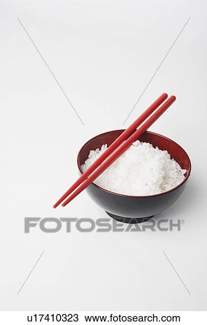 High angle view of a pair of chopsticks on a bowl of rice View Large Photo Image Stock Image - High angle view of a pair of chopsticks on a bowl of rice. Fotosearch