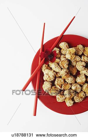 High angle view of food in a plate with a pair of chopsticks View Large Photo Image Stock Image - High angle view of food in a plate with a pair of chopsticks. Fotosearch