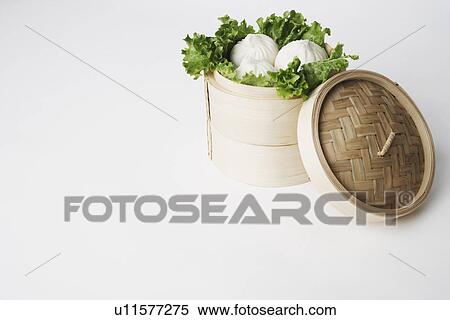 High angle view of steamed dumplings in a steamer View Large Photo Image Stock Photography - High angle view of steamed dumplings in a steamer. Fotosearch