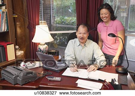 Stock Photo - Portrait of a senior man and a mature woman smiling. Fotosearch