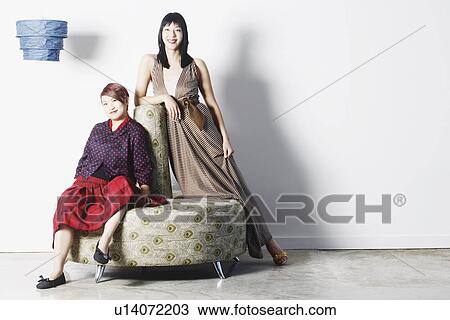 Portrait of two young women smiling View Large Photo Image Stock Image - Portrait of two young women smiling. Fotosearch