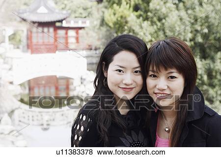 Portrait of two young women smiling View Large Photo Image Stock Photo - Portrait of two young women smiling. Fotosearch