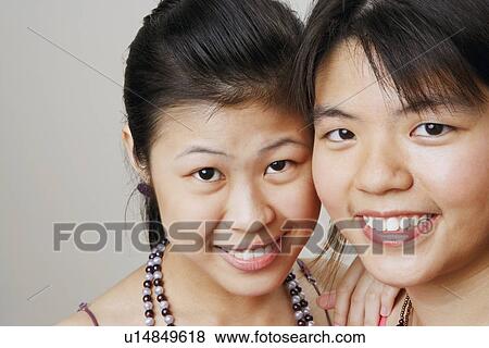 Portrait of two young women smiling View Large Photo Image Stock Photo - Portrait of two young women smiling. Fotosearch