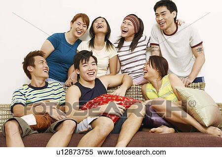 Stock Photography - Close-up of a group of friends smiling. Fotosearch