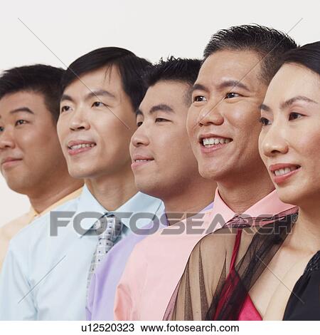 Close-up of business executives smiling and looking away View Large Photo Image Stock Image - Close-up of business executives smiling and looking away. Fotosearch