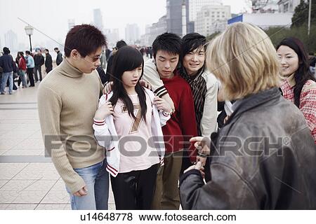 Group of people standing together View Large Photo Image Stock Photo - Group of people standing together. Fotosearch