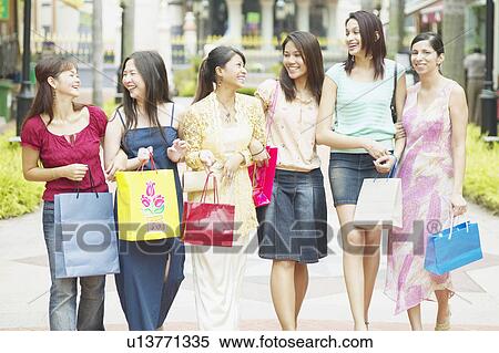 Group of women walking with shopping bags View Large Photo Image Stock Photography - Group of women walking with shopping bags. Fotosearch