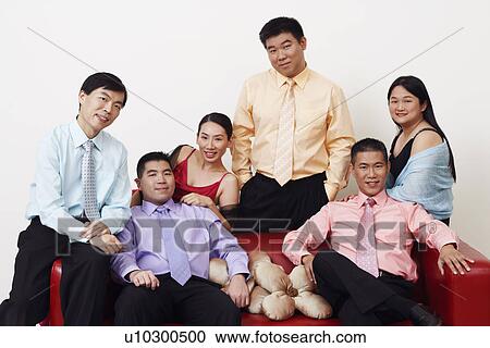 Stock Image - Portrait of a group of business executives posing. Fotosearch