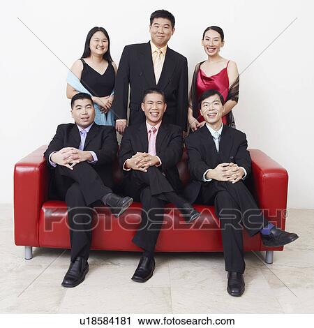 Stock Image - Portrait of a group of business executives posing. Fotosearch
