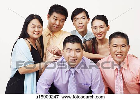 Stock Photo - Portrait of a group of business executives posing. Fotosearch