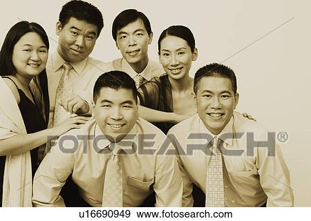 Stock Photo - Portrait of a group of business executives posing. Fotosearch
