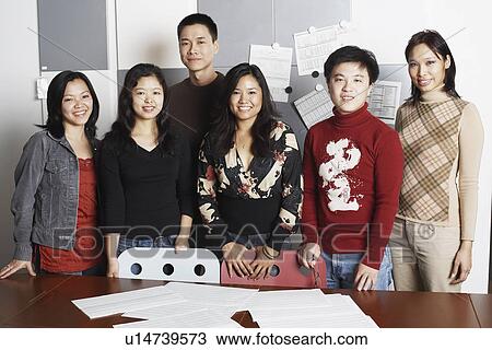Portrait of a group of office workers smiling View Large Photo Image Stock Image - Portrait of a group of office workers smiling. Fotosearch