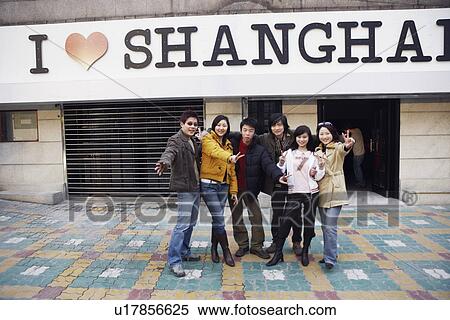 Stock Photography - Portrait of a group of people standing together smiling. Fotosearch